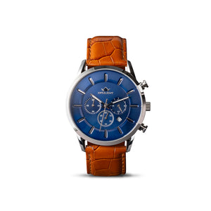 front view of wrist watch with blue face and steel body and tan leather strap